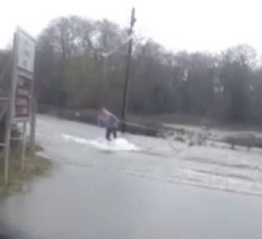 Hilarious video shows one man's brilliant transport response to flooded roads