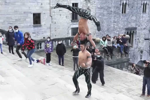 The acrobat climbed 100 steps, carrying his brother on his head