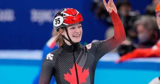 كندا - فازت المتزلجة السريعة الكندية كيم بوتين بالميدالية البرونزية في حدث 500 م سيدات في أولمبياد بكين