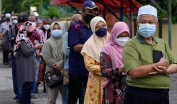 Le parti au pouvoir en Malaisie remporte à nouveau gros dans les sondages d'État